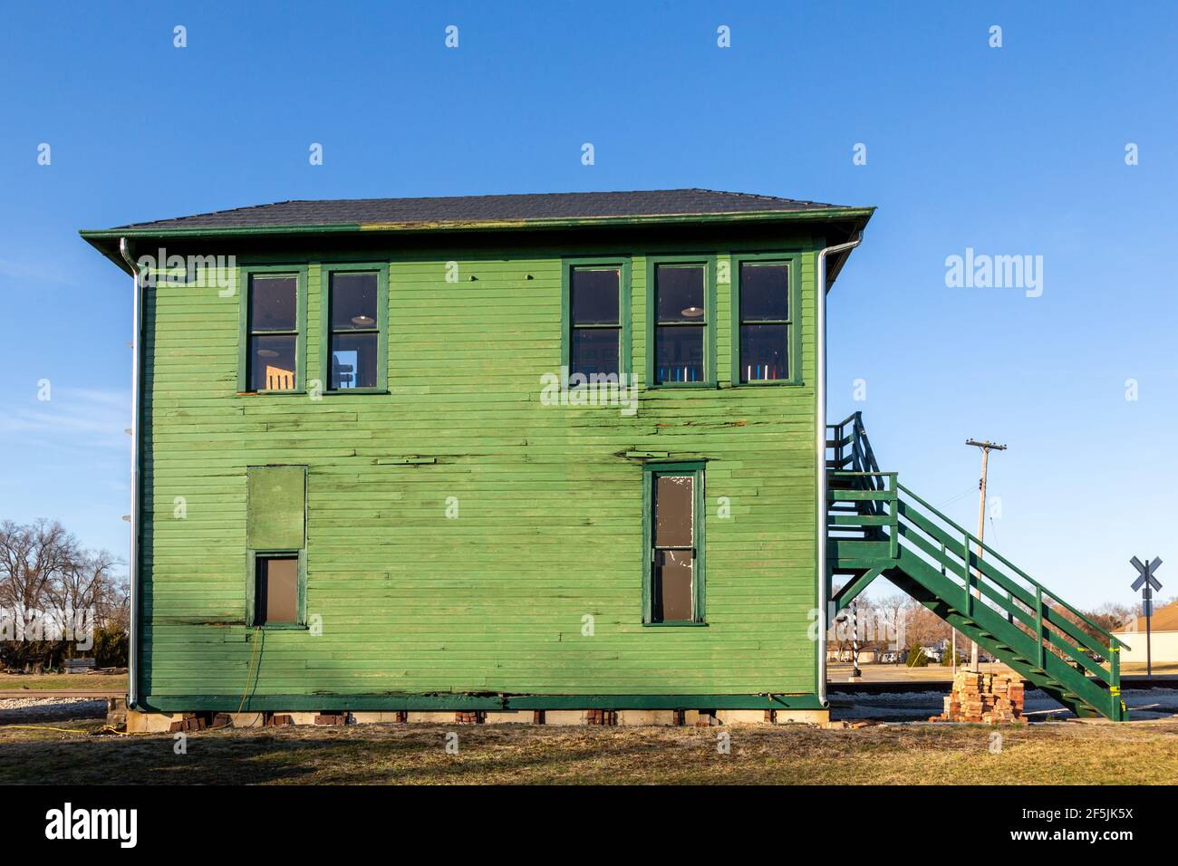 The green 1906 Grasselli Interlocking Railroad Tower stands at the