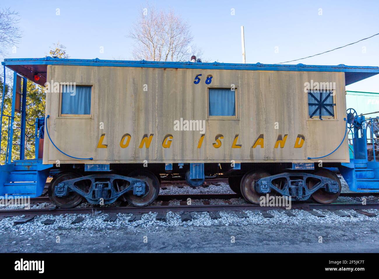 A restored antique Long Island Railroad caboose sits on display at the