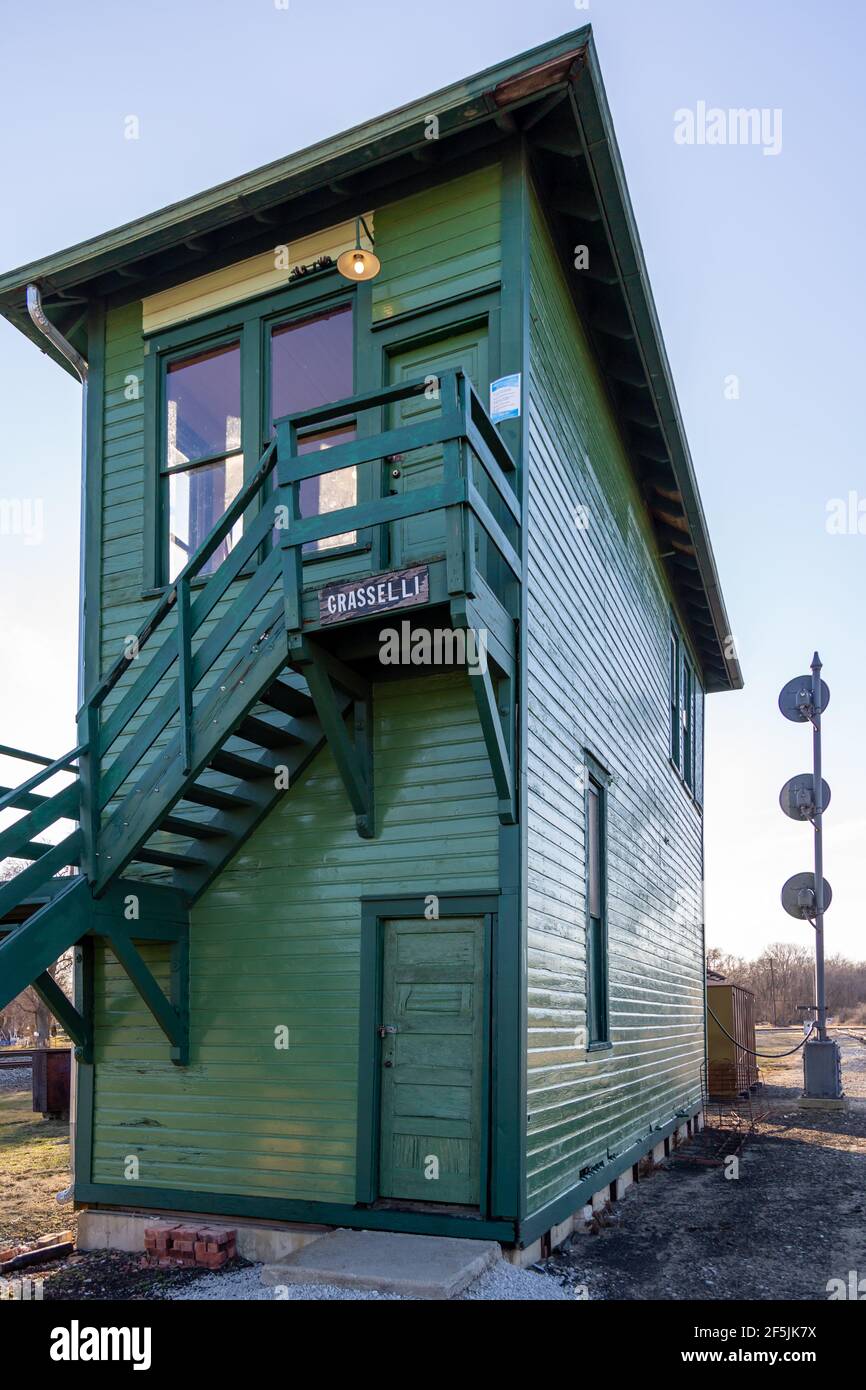 The green 1906 Grasselli Interlocking Railroad Tower stands at the