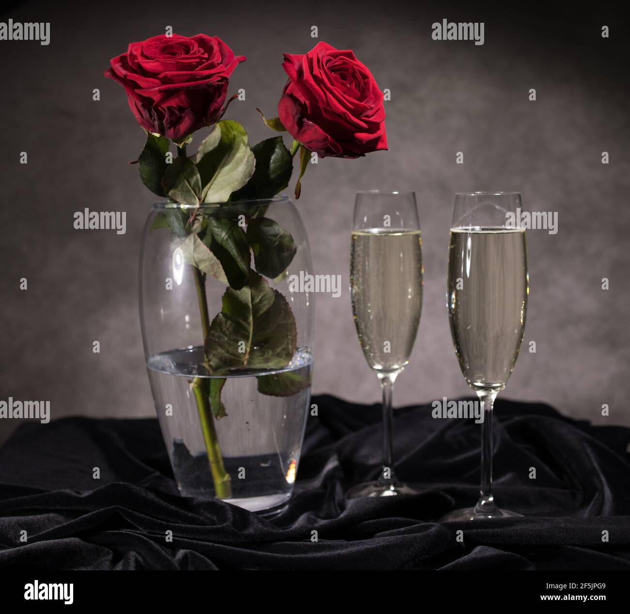 Couple red roses champagne hi-res stock photography and images - Alamy
