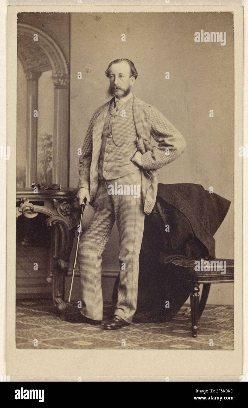 Unidentified bearded man standing, holding a walking stick. Thomas Rodger (Scottish, 1832 - 1883) Stock Photo