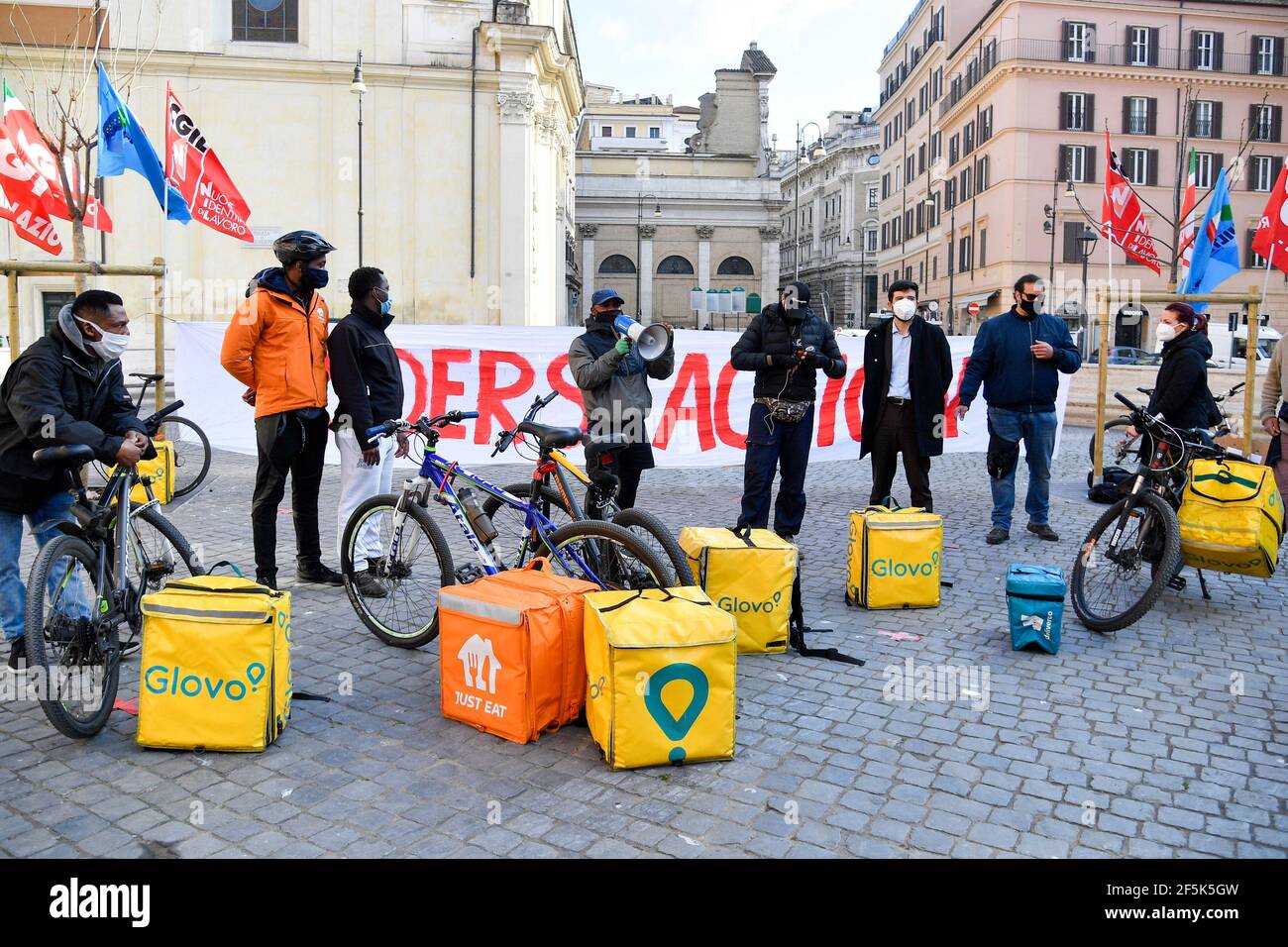 Delivery men from different companies seen during the demonstration ...