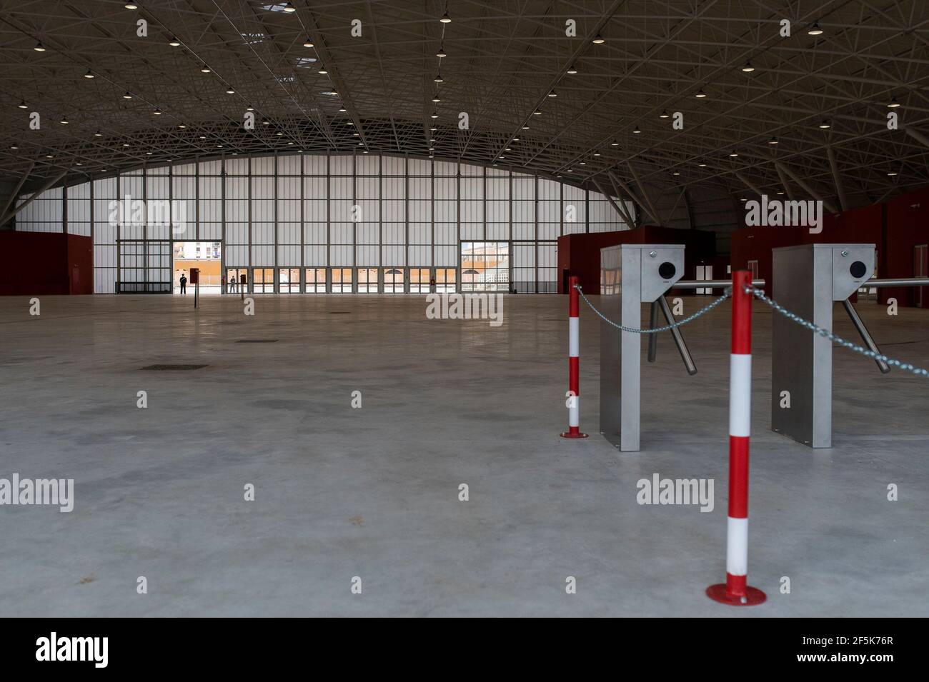 An empty interior view of the new hub.Lieutenant general, Francesco Paolo Figliuolo, recently appointed as extraordinary commissioner for the COVID-19 emergency, and Fabrizio Curcio, Head of Department of Civil Protection, visited the new vaccination hubs in Calabria. In Catanzaro, in the seacoast district “Lido”, they visited the new Trade Fair Center selected as potential hub. Sergio Abramo, Mayor of Catanzaro, and Antonino Spirlì, and temporary Regional Governor, guided them during the visit. The increasing of vaccination hubs is considered a priority, especially considering the rising numb Stock Photo