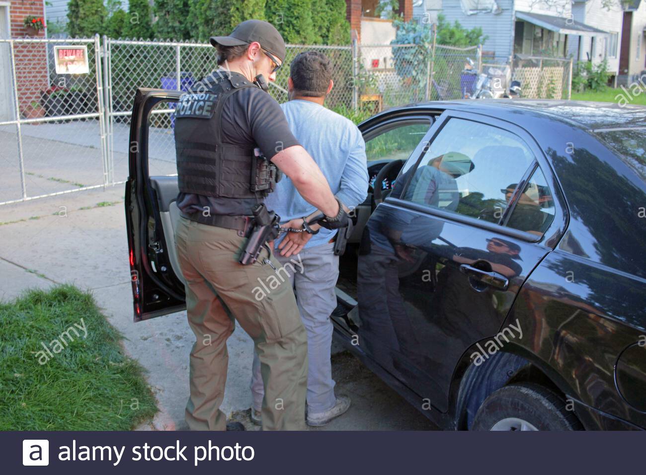 Man Handcuffed Police Car High Resolution Stock Photography and Images