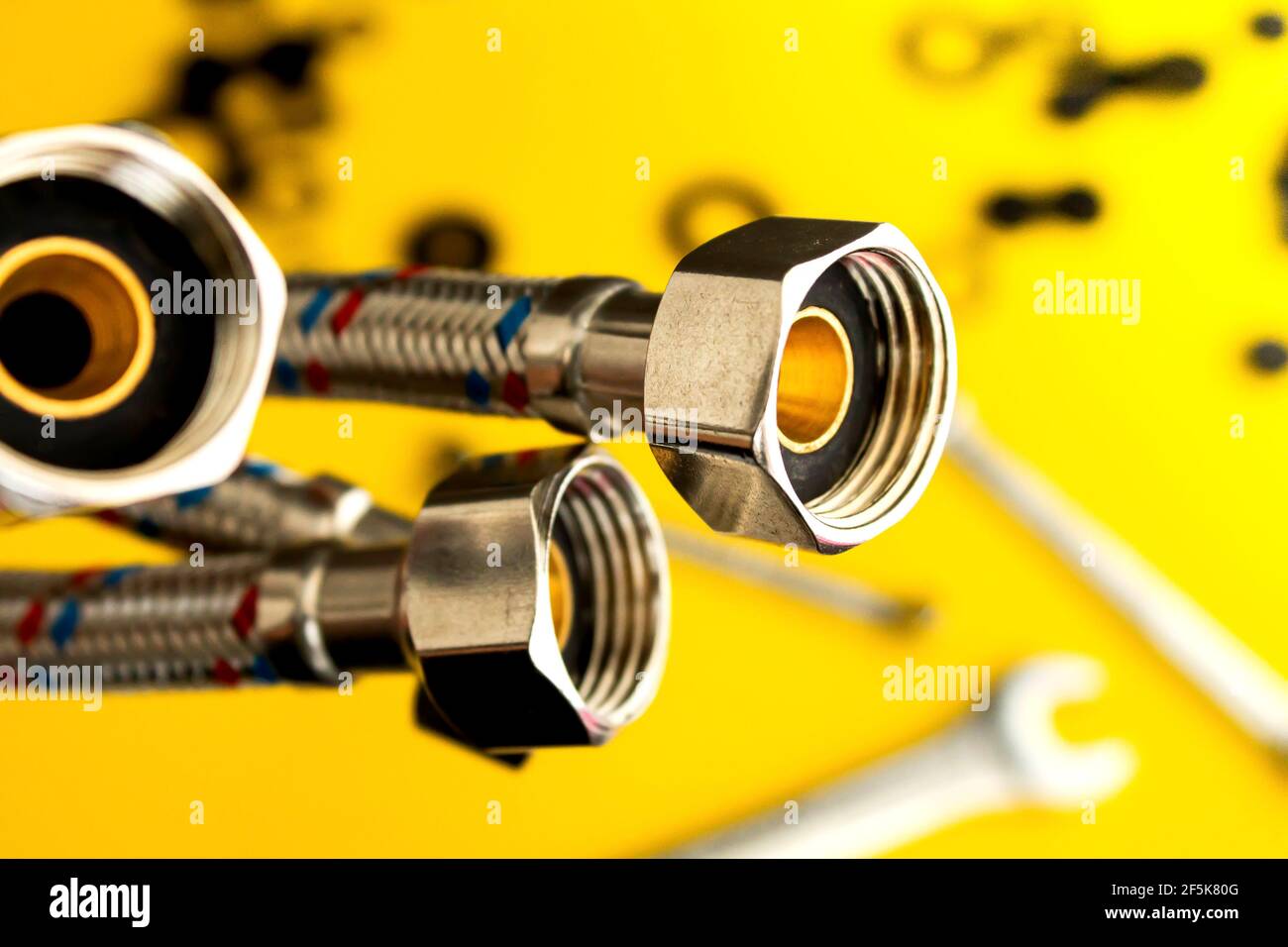 Plumbing hose and tool kit for plumbing installation. Plumbing in the house. Closeup of water