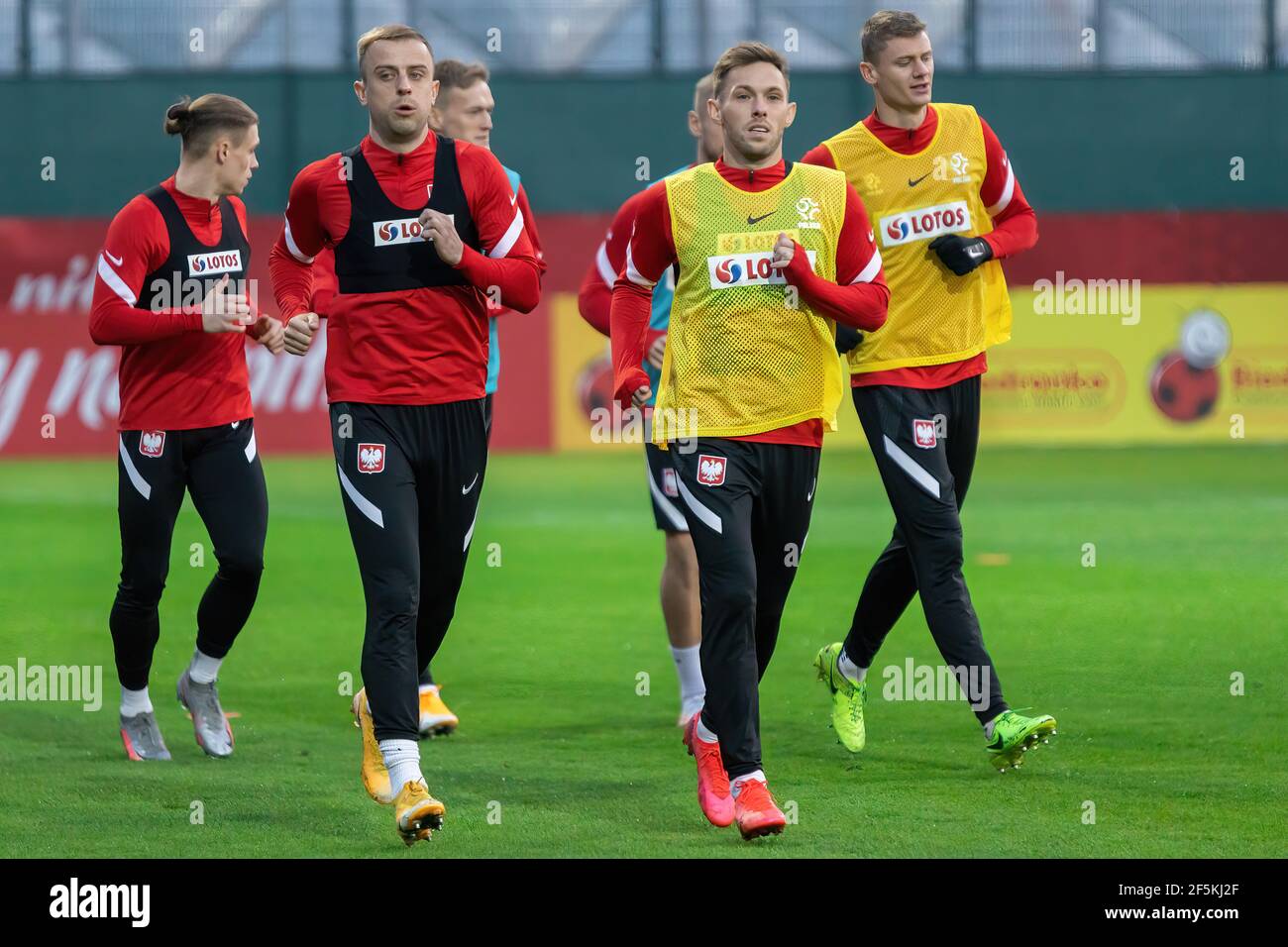 Warsaw, Poland. 26th Mar, 2021. Kamil Grosicki (L) and Maciej Rybus (R) of Poland are seen in action during the official training session of the Polish national football team before FIFA World Cup Qatar 2022 qualification matches in Warsaw. Credit: SOPA Images Limited/Alamy Live News Stock Photo