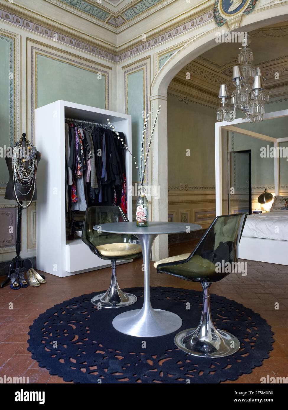 Beautiful bedroom with a wardrobe and canopy bed in a elegant house in Florence, Italy Stock Photo