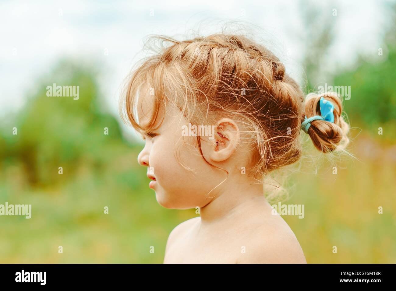 portrait of a happy little girl outdoors Stock Photo - Alamy