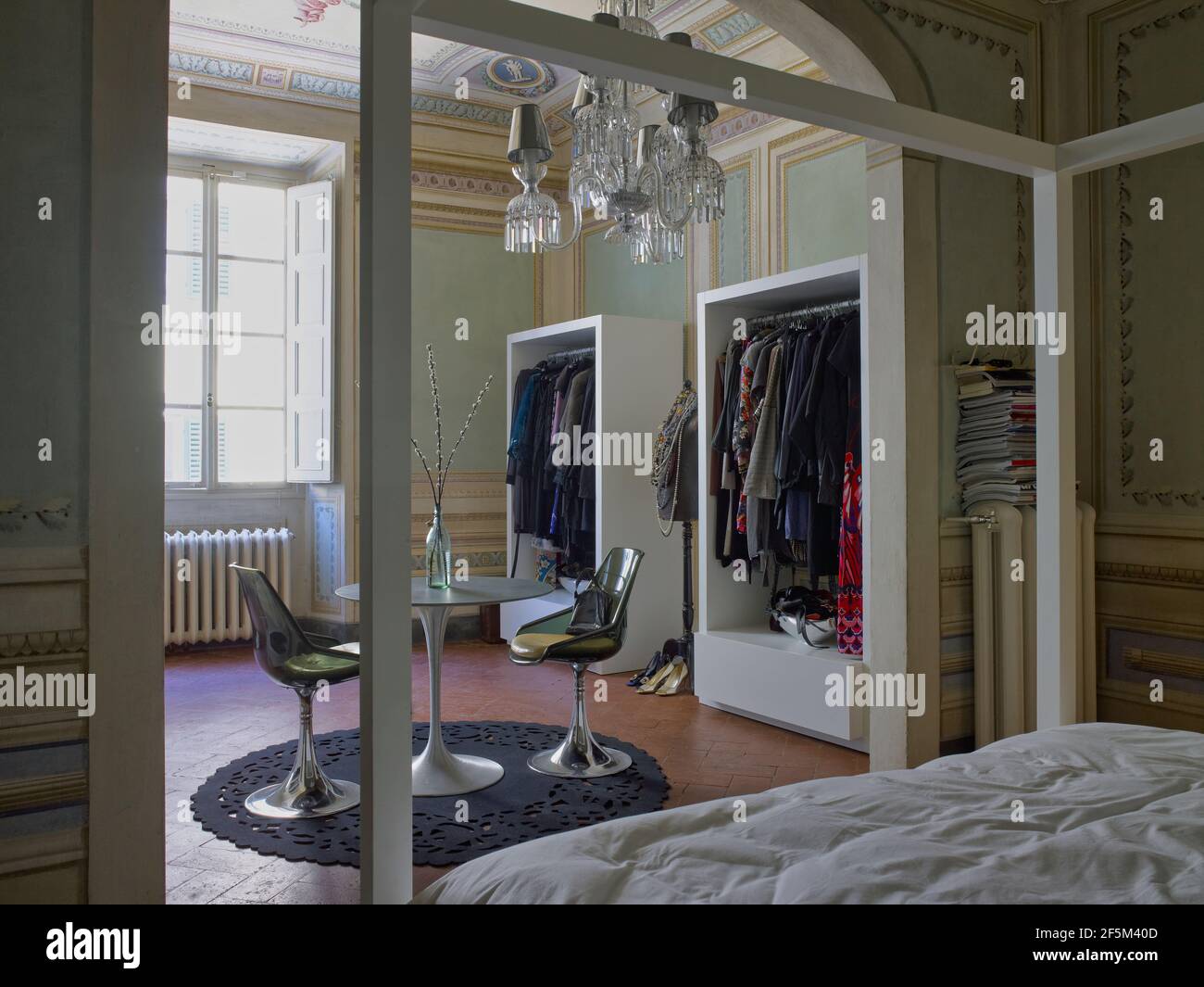 Beautiful bedroom with a wardrobe and canopy bed in a elegant house in Florence, Italy Stock Photo