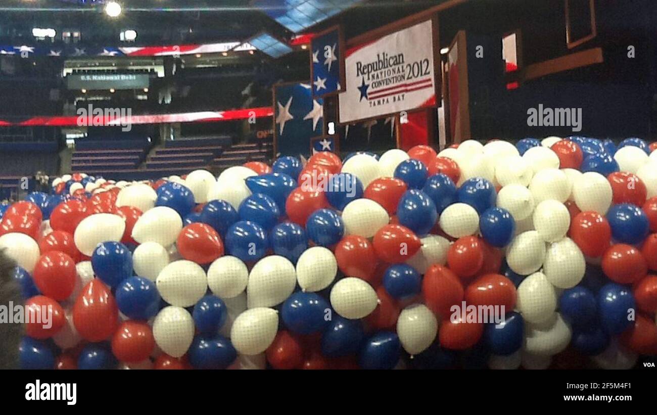 Red white and blue balloons bundled up before being lifted to the