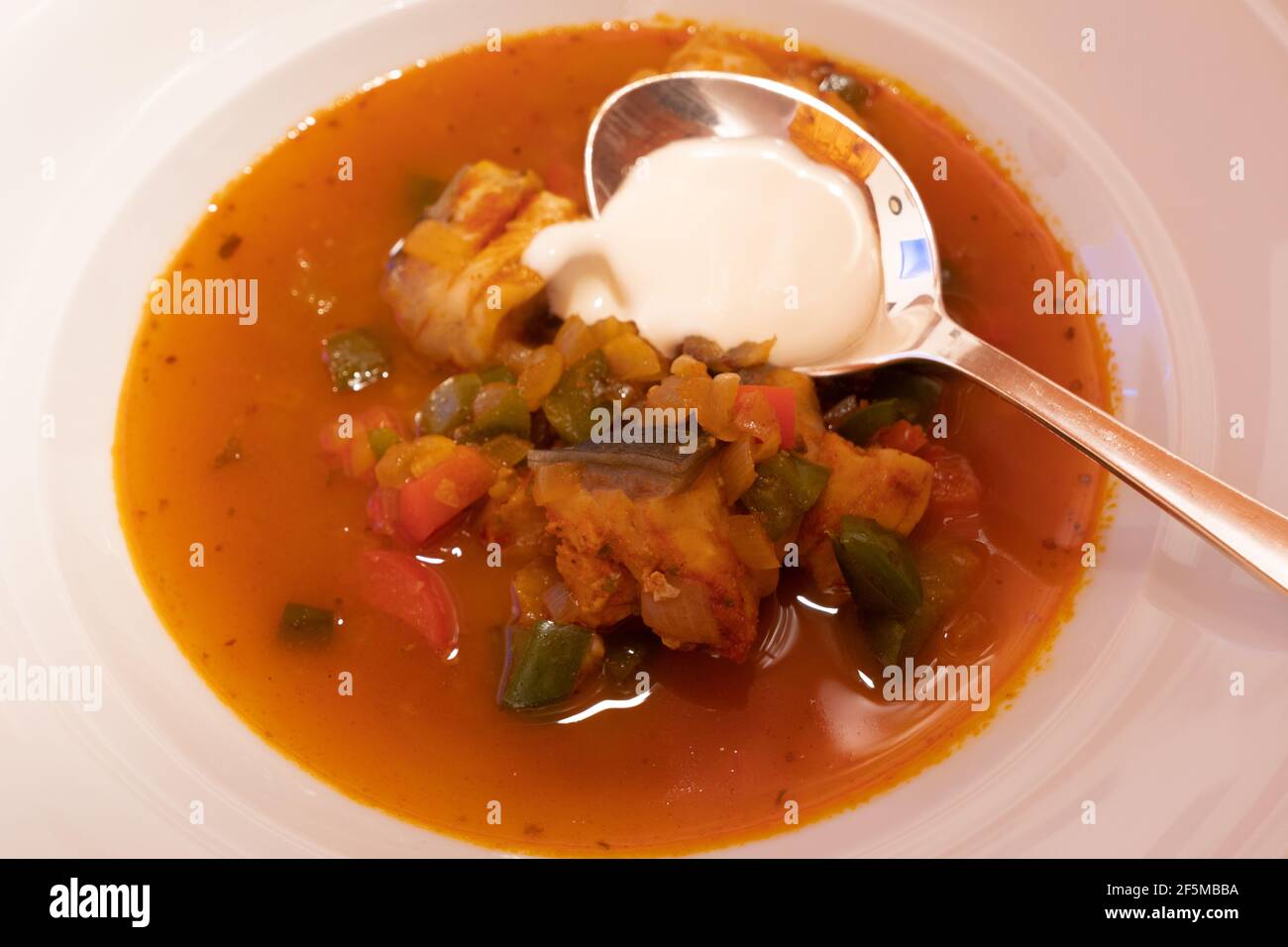 Halaszle, Hungarian Fishermans Soup or Fish Stew with Carp, Bell Peppers, Paprika and Sour Cream Stock Photo