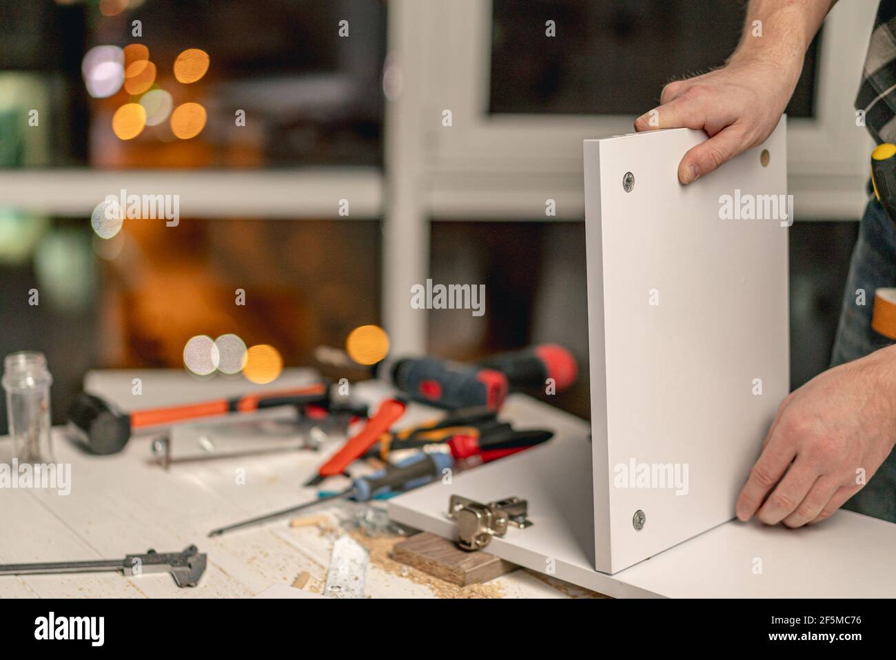 Man working during process of furniture manufacturing Stock Photo - Alamy