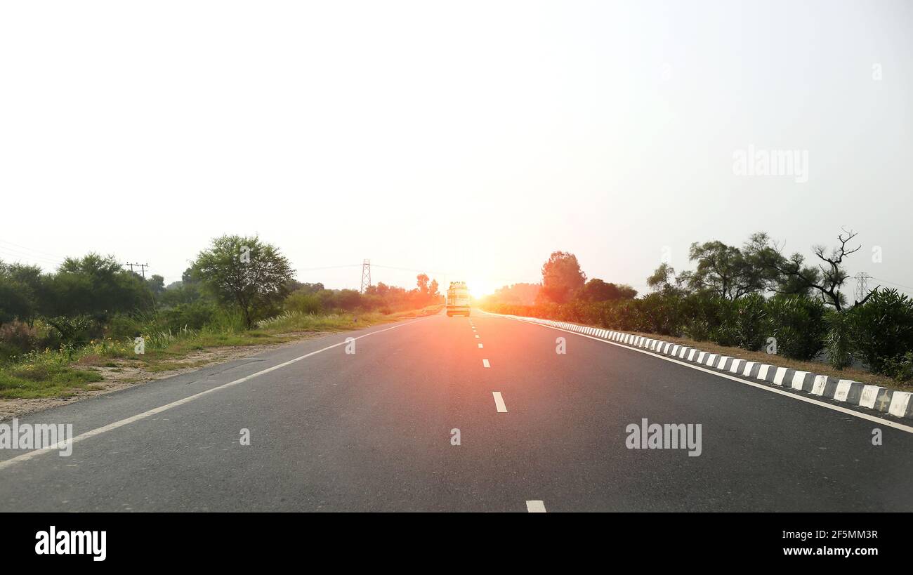 Beautiful sunset view on highway road Stock Photo