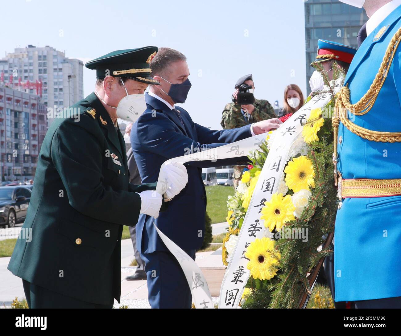 Belgrade, Serbia. 26th Mar, 2021. Chinese State Councilor and Minister of National Defense Wei Fenghe (L) pays homage to the martyrs killed in the NATO bombing of the Chinese embassy in the Federal Republic of Yugoslavia in 1999, in Belgrade, Serbia, March 26, 2021. Credit: Li Xiaowei/Xinhua/Alamy Live News Stock Photo