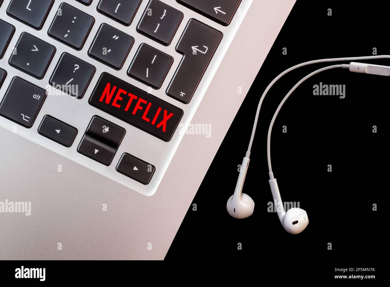 Laptop with Netflix logo on keyboard. Illustration. Stock Photo