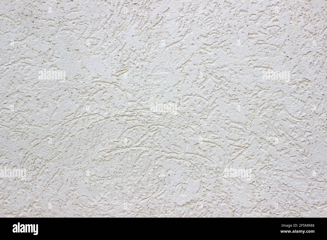 Rough white concrete wall. Small cracks on the surface. Background texture Stock Photo