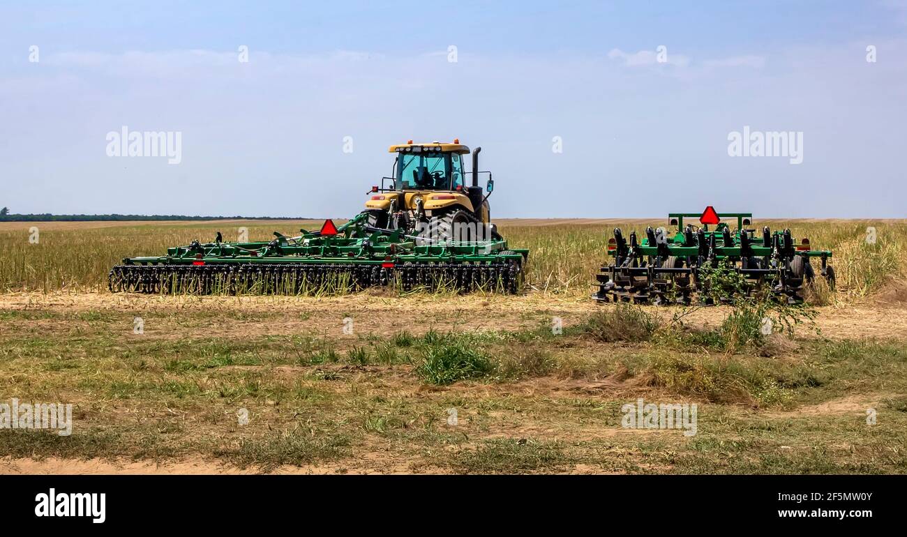 The machinery ready to prepare the ground for sowing and cultivation. Agriculture and agronomy concept. Stock Photo