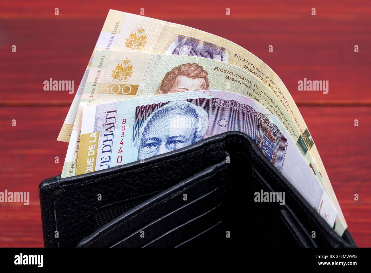 Haitian money in the black wallet Stock Photo Alamy