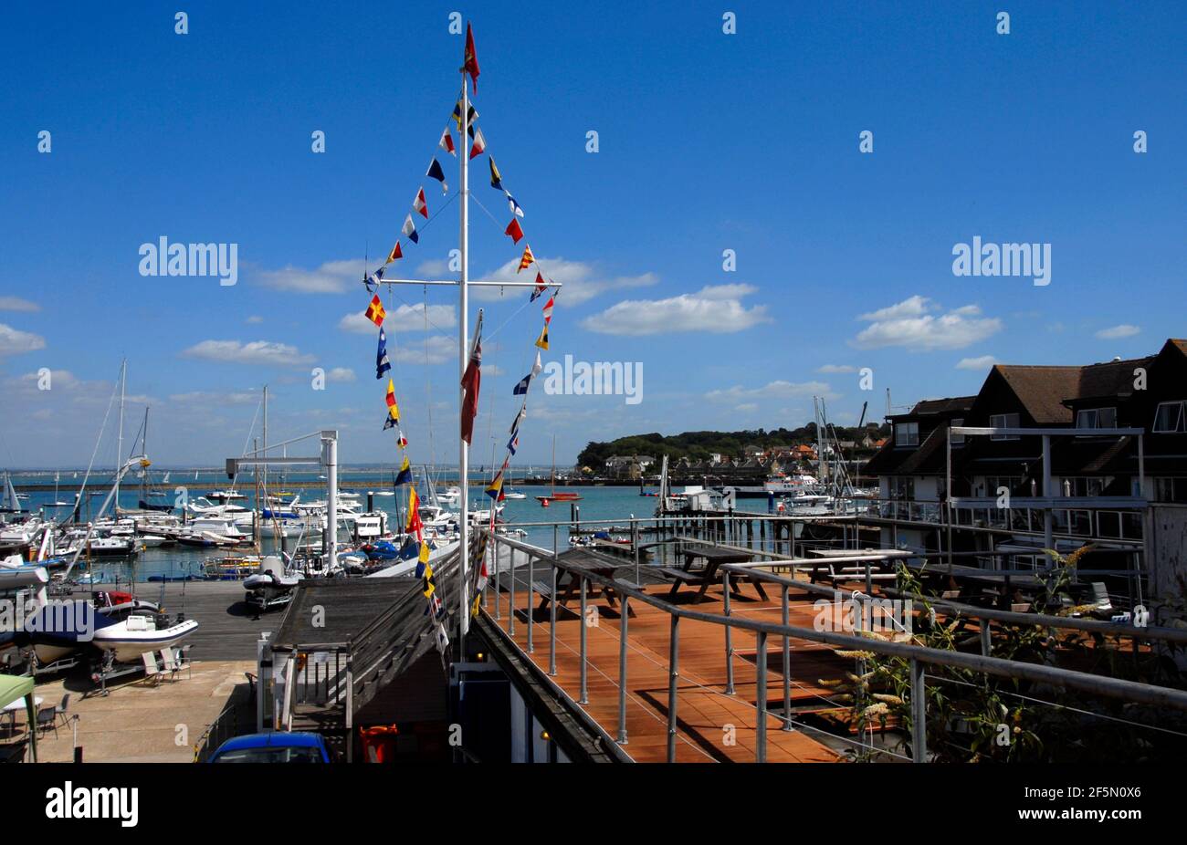 Bunting arranged on a shore-based mast during Cowes week, Cowes, Isle of Wight, England Stock Photo