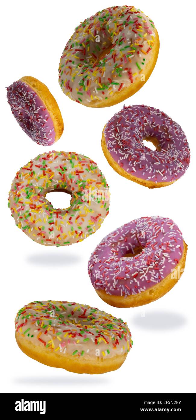 flying donuts isolated on white background. selective focus. set of multicolored crumpets. Stock Photo