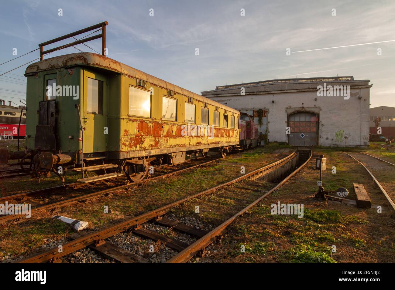 A rusty old rail wagon standing in front of a depot near Dolní Nádraží train station in Czech town of Brno. Stock Photo