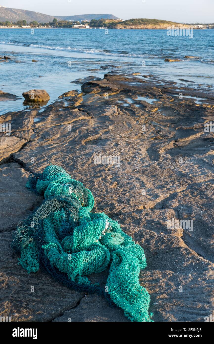 Sea pollution, discarded fishing net washed up on a Greek beach Stock