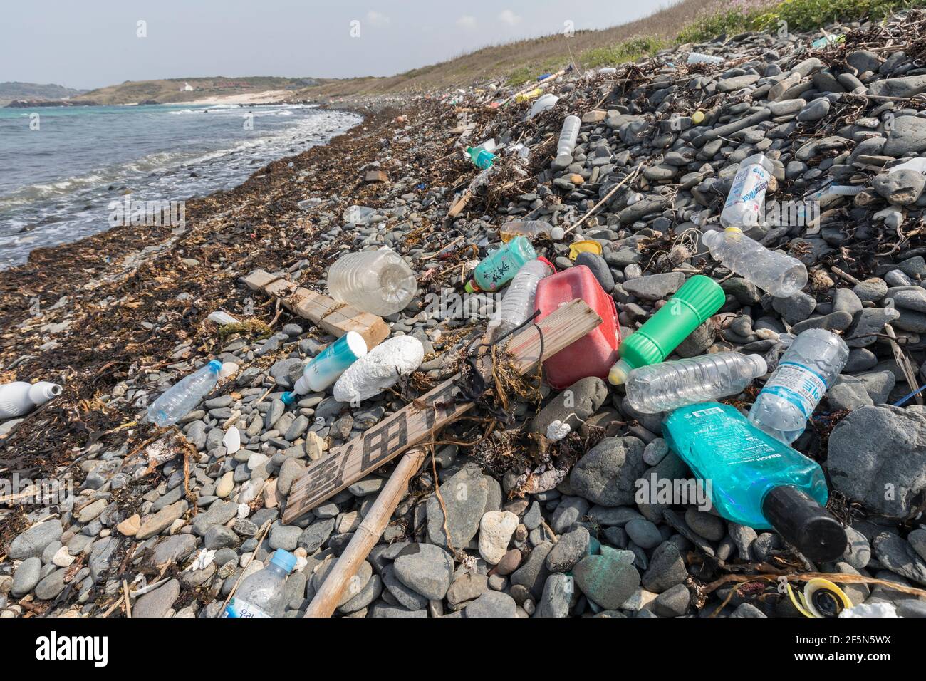 Plastic waste and litter polluting the coast of Tsunoshima island