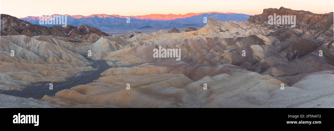 Panorama sunset or sunrise view of Zabriskie Point and the rugged sedimentary rock terrain of