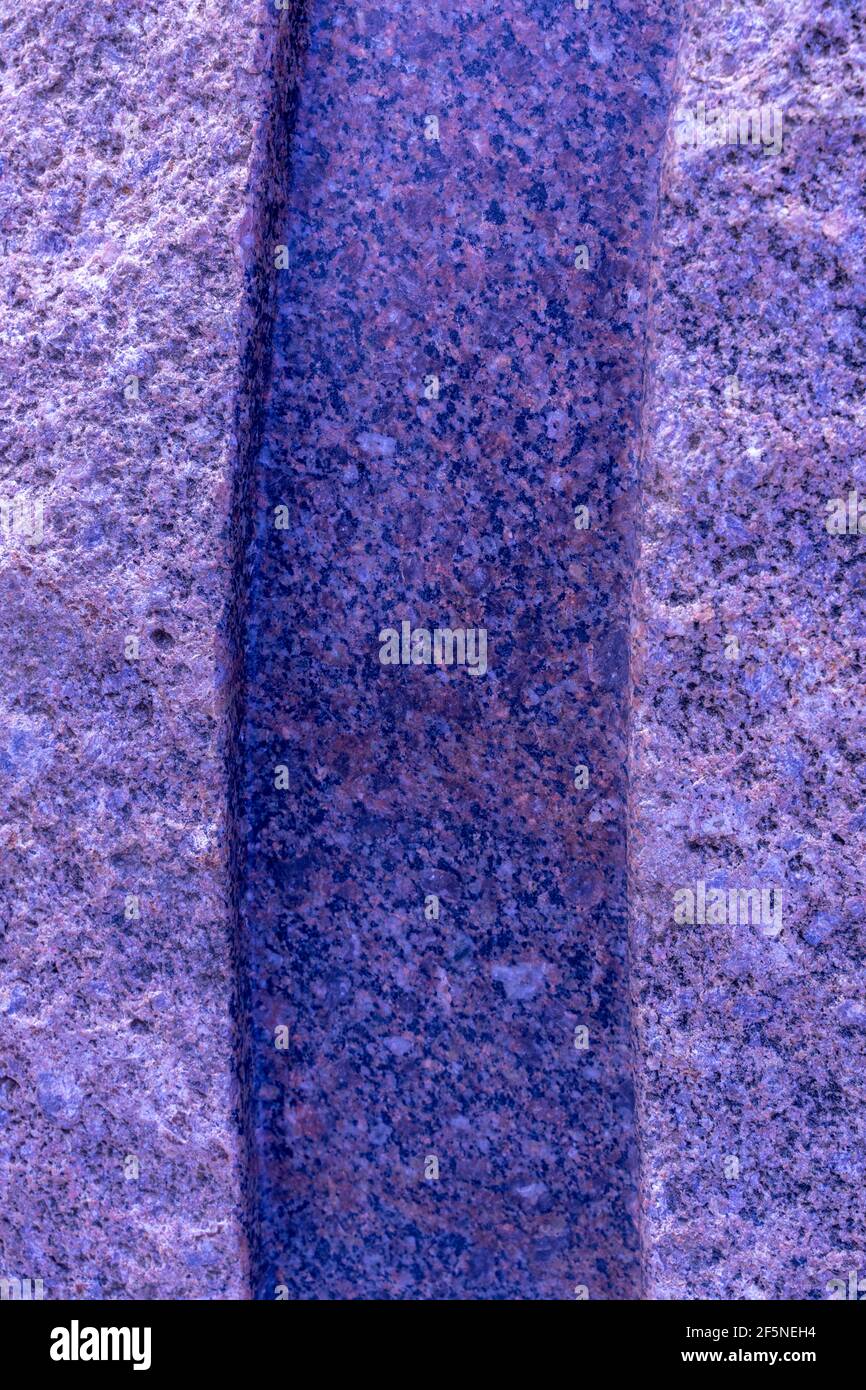 granite surface with a blue tint and a dark longitudinal stripe. stone background Stock Photo