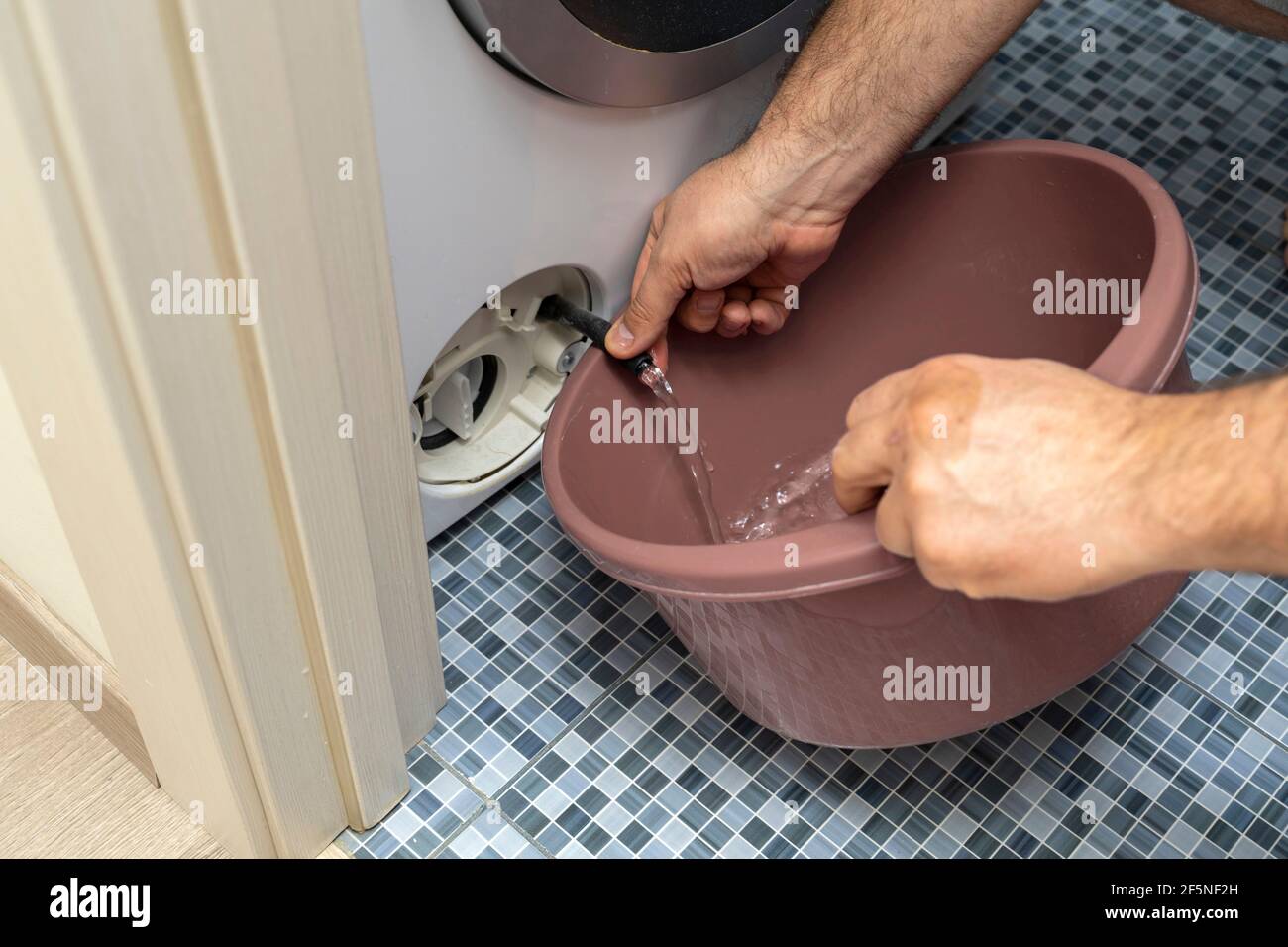 Washing machine water filter clogged hires stock photography and