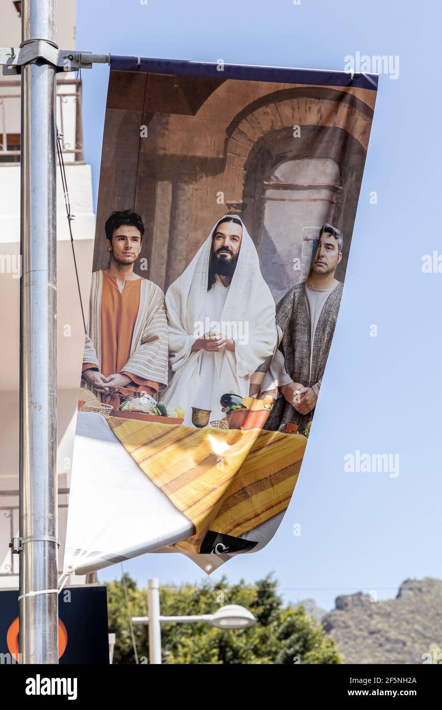 Adeje, Tenerife, Canary Islands, Spain. 26 March 2021. Photographs by Phil Crean of previous years Passion play displayed on banners at churches and o Stock Photo