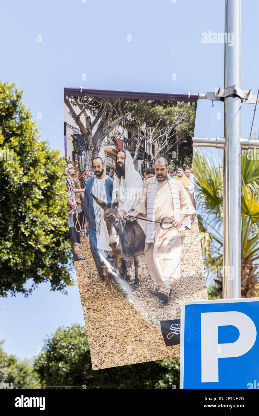 Adeje, Tenerife, Canary Islands, Spain. 26 March 2021. Photographs by Phil Crean of previous years Passion play displayed on banners at churches and o Stock Photo