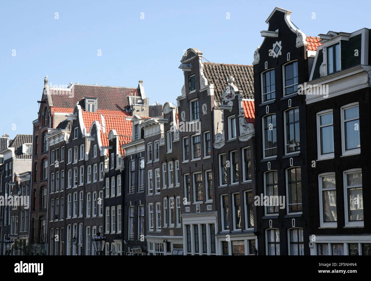 Traditional Dutch Houses with lifting Hooks on row at Old Town in Amsterdam, Netherlands Stock