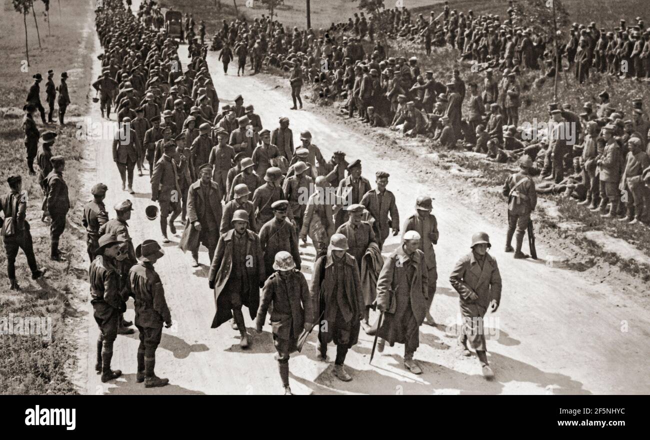 August 1918, and German prisoners of war are marching near Amien, Northern France, during the closing stages of  World War One. Stock Photo