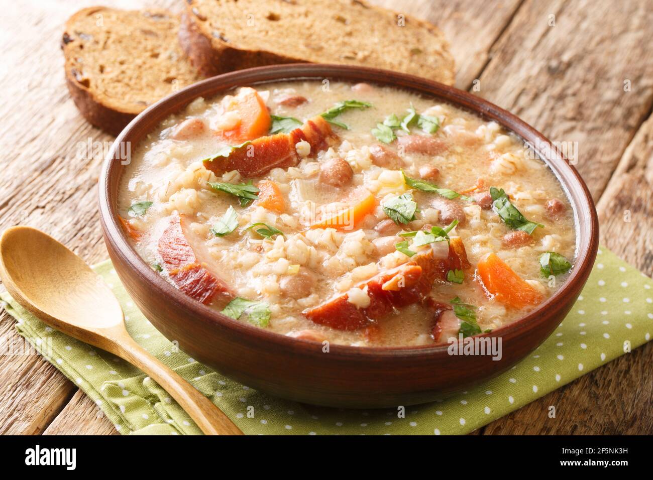 Slovenian Meat and Vegetable Barley Soup Ricet close-up in a bowl on the table. Horizontal Stock Photo