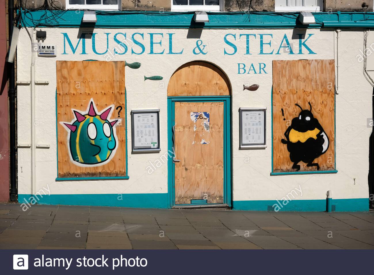 Mussel & Steak bar, West Bow Grassmarket, boarded up and closed due to the Covid-19 Coronavirus lockdown measures, Edinburgh, Scotland Stock Photo