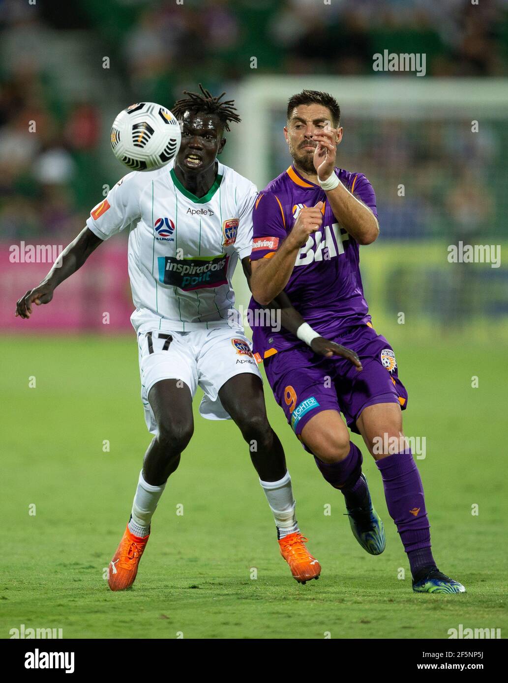 27th March 2021; HBF Park, Perth, Western Australia, Australia; A League Football, Perth Glory versus Newcastle Jets; Bruno Fornaroli Mezza of the Perth Glory challenges for the loose ball against Kuach Yuel of the Newcastle Jets Stock Photo