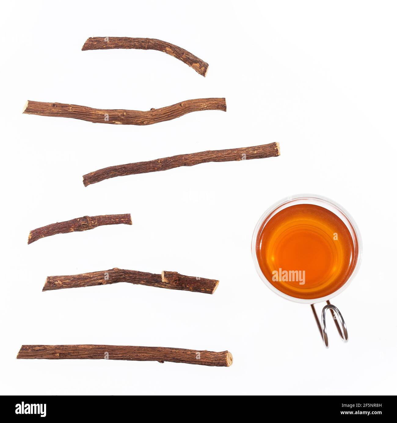 Licorice tea cup and root pieces Glycyrrhiza glabra Stock Photo Alamy