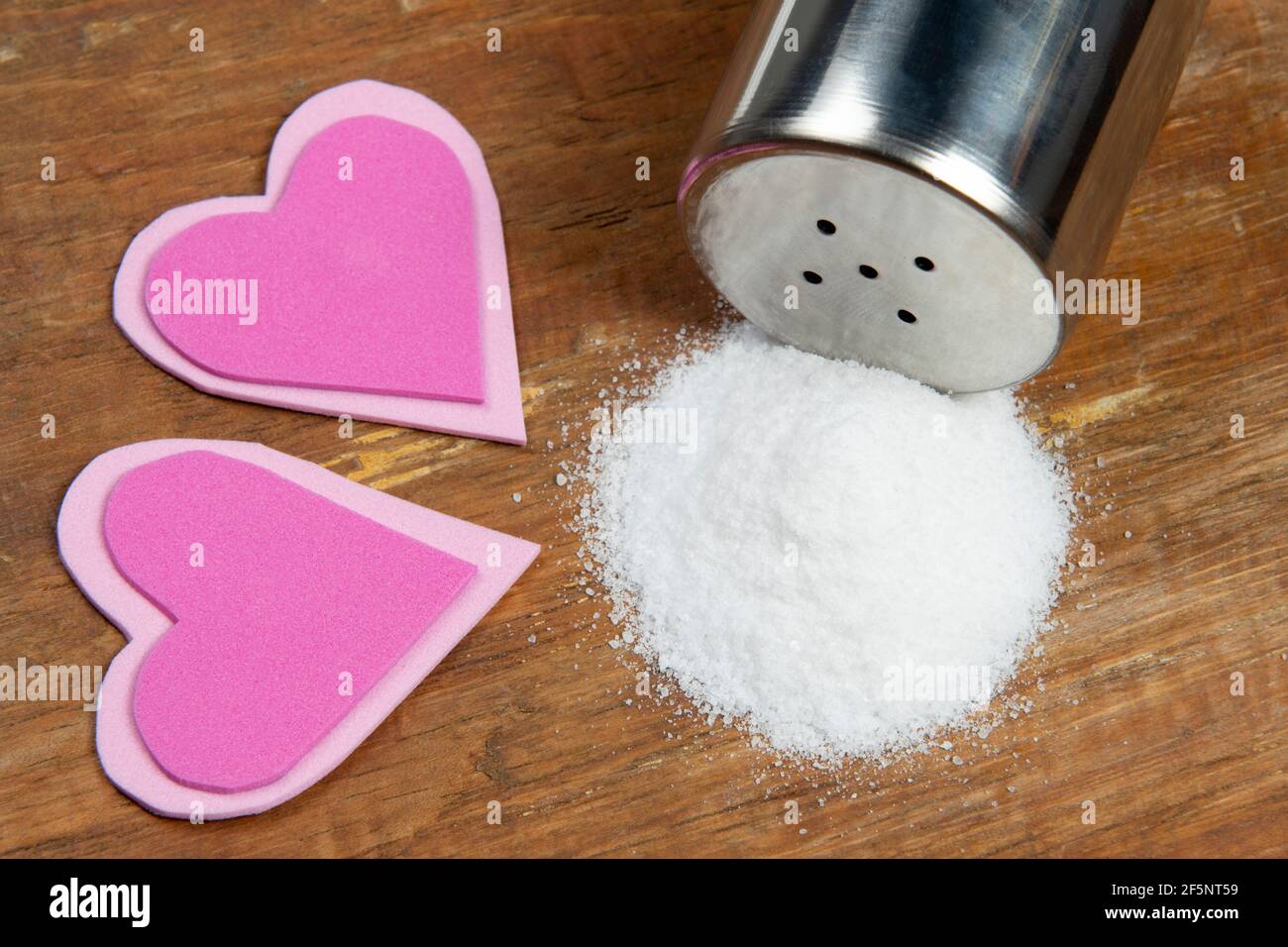 Salt causing high blood pressure and heart comorbidities Stock Photo