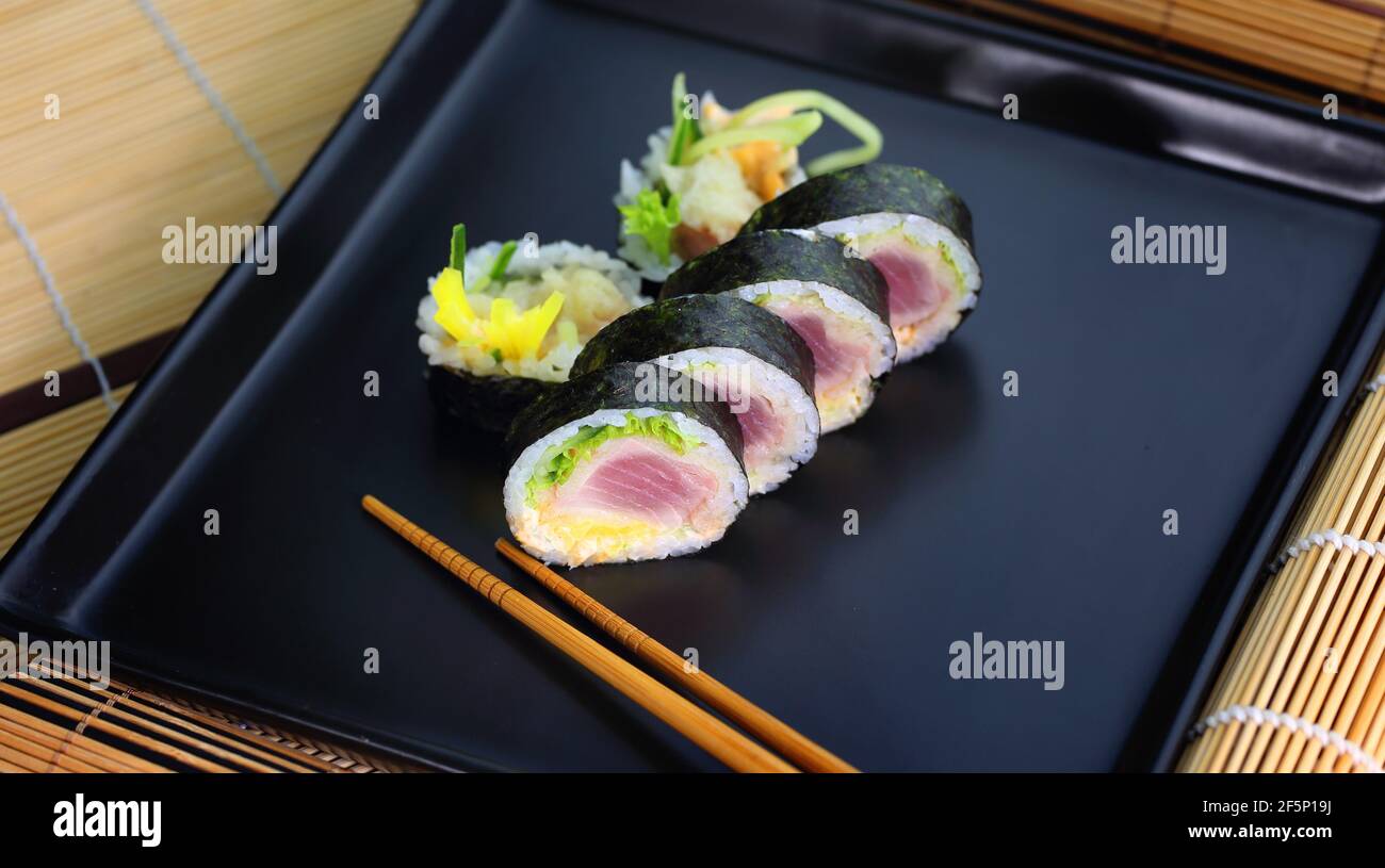 colorful and interesting sushi rolls served in an appetizing way Stock Photo