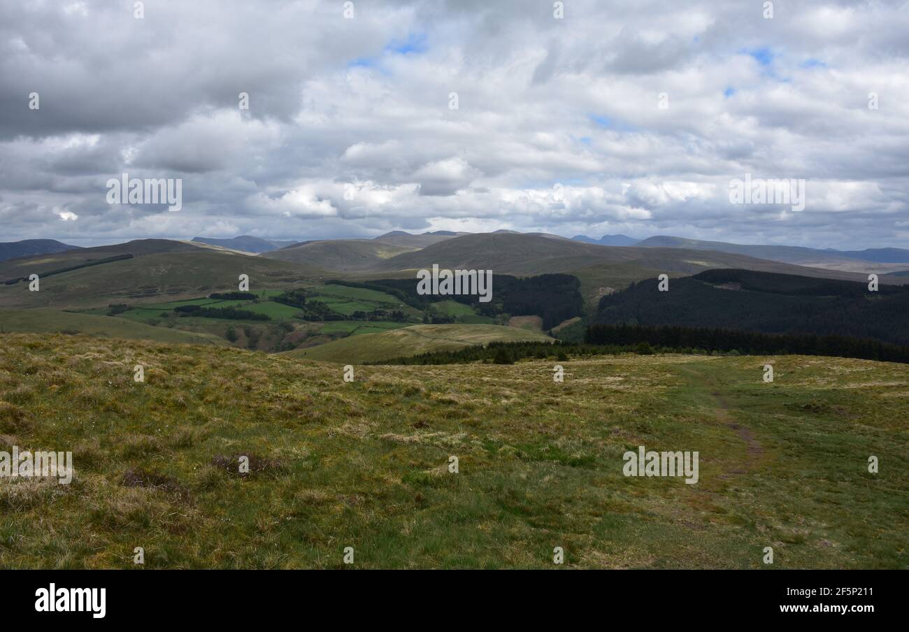 Beautiful thick fluffy white clouds over rolling hills Stock Photo - Alamy