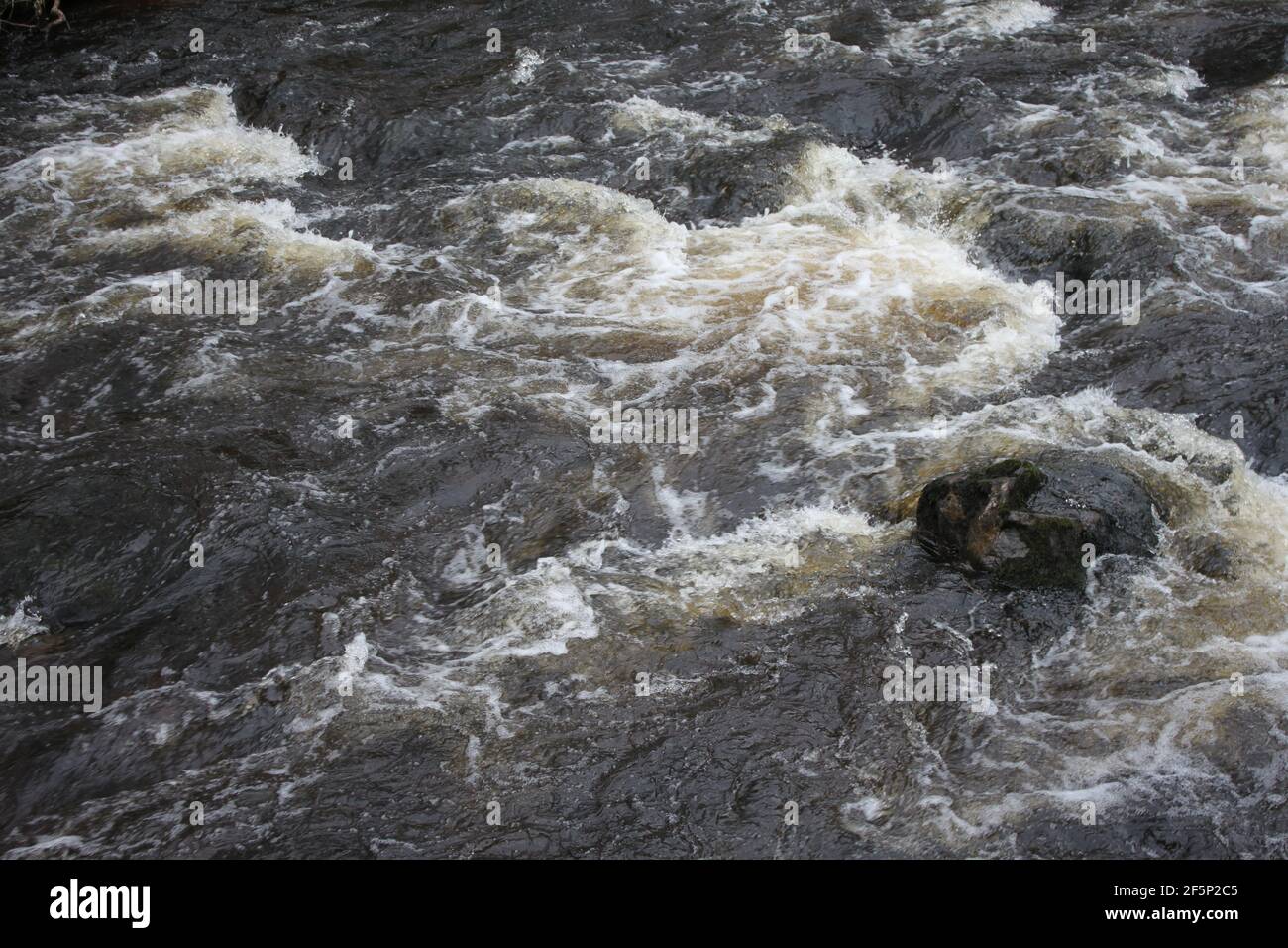 Rivers in the United Kingdom. Tributaries and streams, angry water. Danger in the water. Stock Photo
