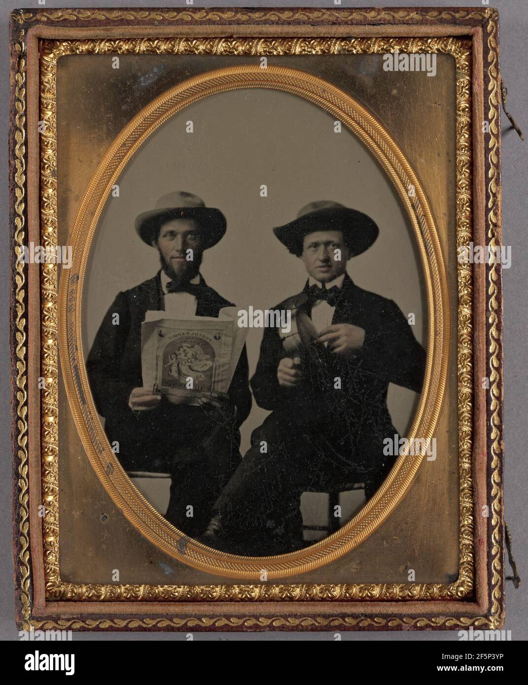 Two seated men wearing hats hi-res stock photography and images - Alamy