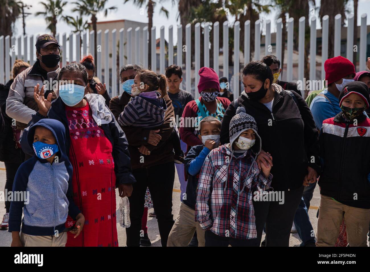 Tijuana, Mexico. 27th Mar, 2021. Asylum seekers demonstrate at the San Ysidro border crossing in Tijuana, Mexico praying and listening to speeches on Friday, March 26, 2021. Many of the them have been sleeping in tents at El Chaparral plaza in hopes of being able to seek asylum in the United States. Photo by Ariana Drehsler/UPI Credit: UPI/Alamy Live News Stock Photo