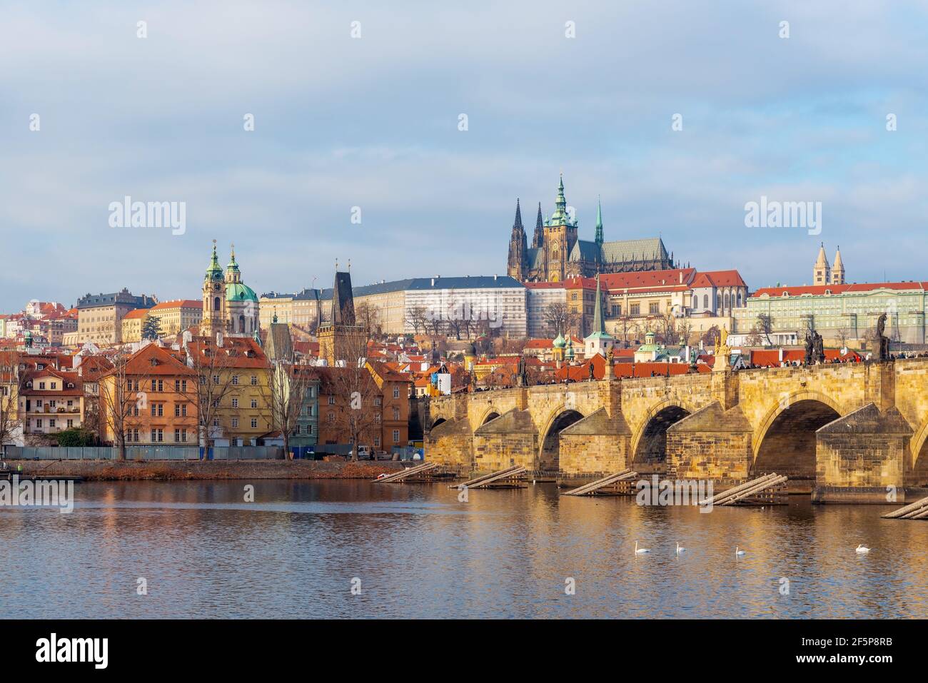Cityscape of Prague at sunrise with view over Mala Strana district with Charles Bridge, Cathedral and Hradcany Castle, Czech Republic. Stock Photo