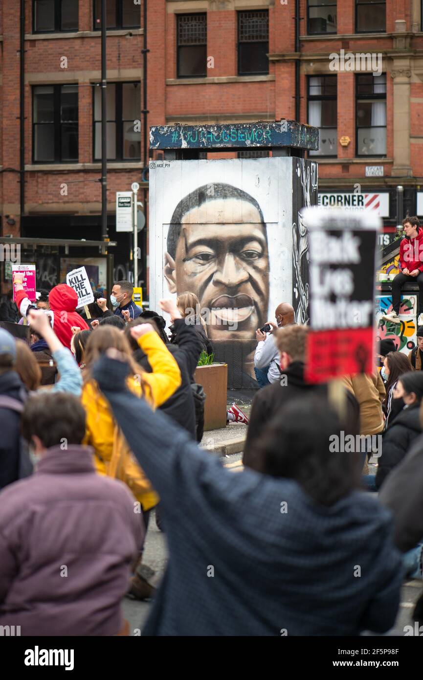 MANCHESTER, UK Protesters 'take a knee' and genuflect in front of the George Floyd mural in Stevenson Square at the 'Kill The Bill' protest in Manchester city centre on Saturday 27th March 2021. (Credit: Pat Scaasi | MI News) Credit: MI News & Sport /Alamy Live News Stock Photo