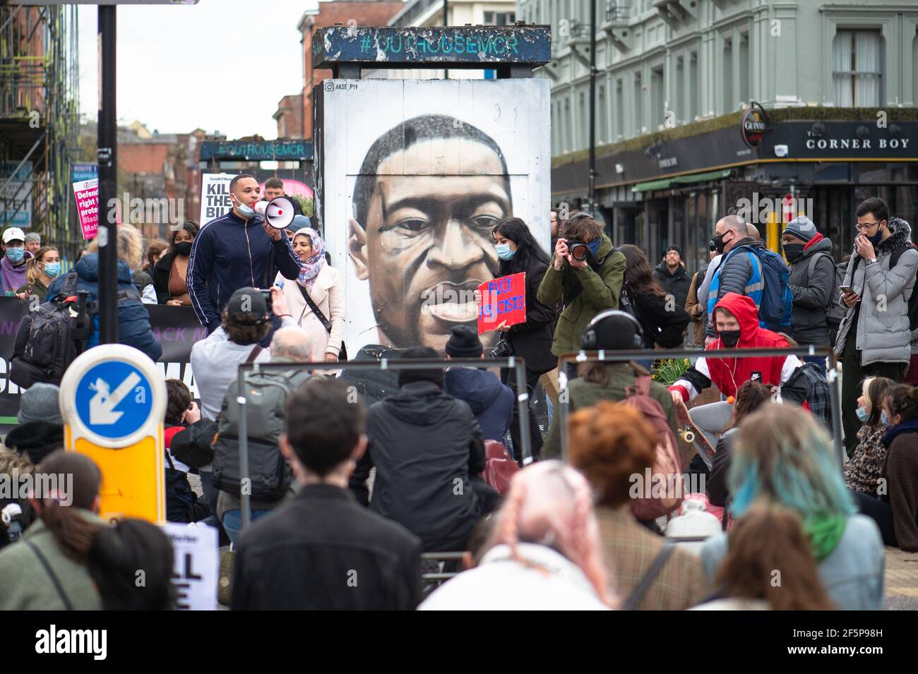 MANCHESTER, UK Protesters 'take a knee' and genuflect in front of the George Floyd mural in Stevenson Square at the 'Kill The Bill' protest in Manchester city centre on Saturday 27th March 2021. (Credit: Pat Scaasi | MI News) Credit: MI News & Sport /Alamy Live News Stock Photo