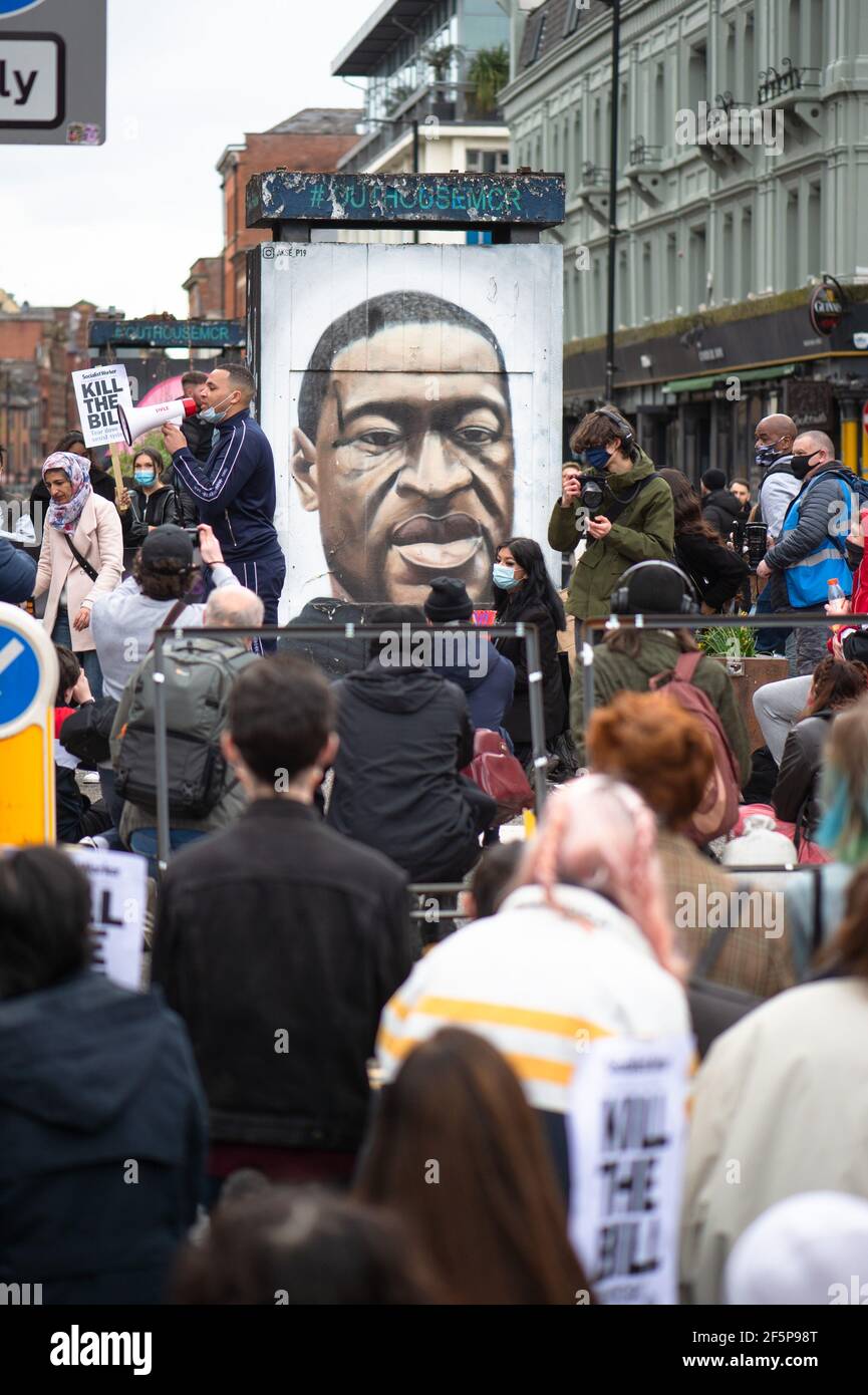 MANCHESTER, UK Protesters 'take a knee' and genuflect in front of the George Floyd mural in Stevenson Square at the 'Kill The Bill' protest in Manchester city centre on Saturday 27th March 2021. (Credit: Pat Scaasi | MI News) Credit: MI News & Sport /Alamy Live News Stock Photo