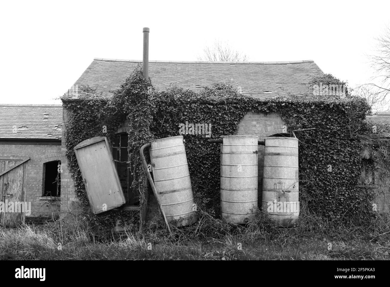 March 2021 - Storage drums beside a rural water drainage pumphouse Stock Photo