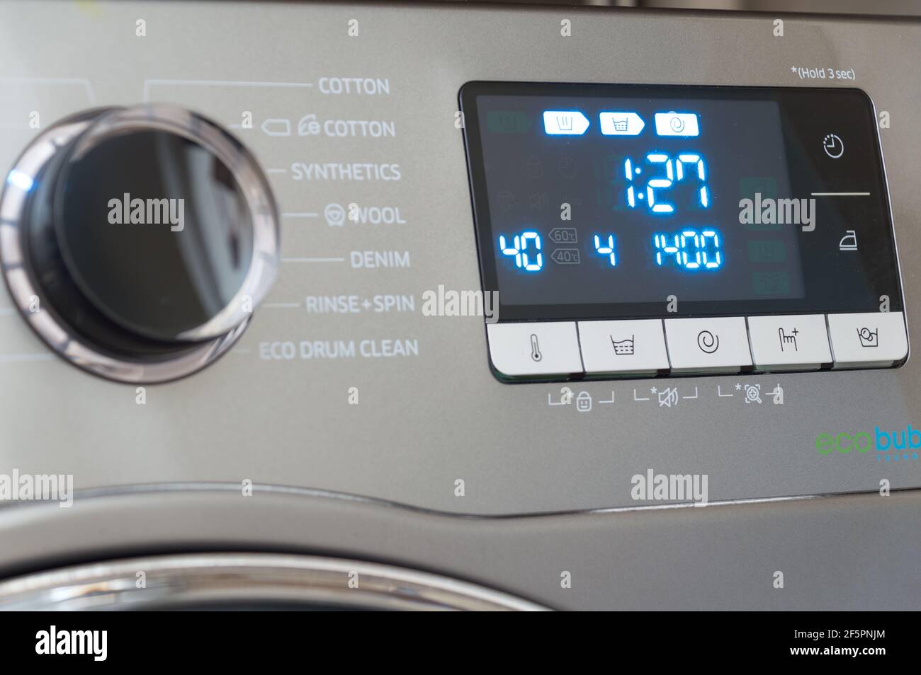 Washing machine control programming panel with round dial and buttons Stock  Photo - Alamy